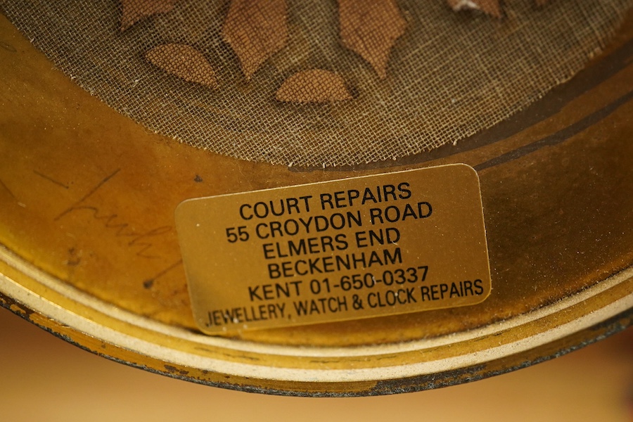 An Edwardian inlaid mahogany mantel clock striking on a coiled gong, 37cm. Condition - fair, untested